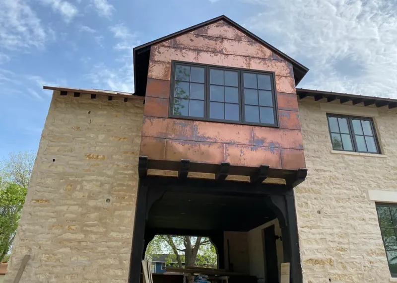 Copper metal panel facade on a stone building for Metal Roof Coating in Maryland City