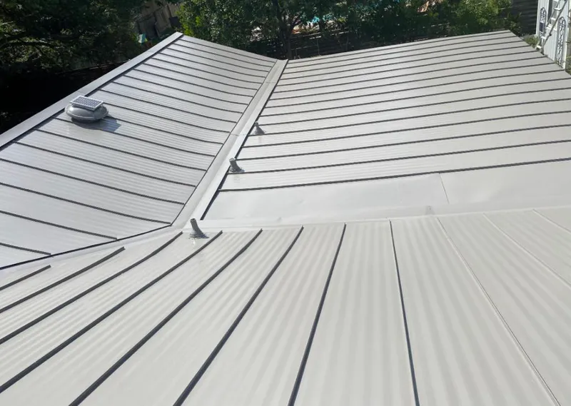 Solar attic fan installed on a metal roof for Roof Ventilation in Maryland City
